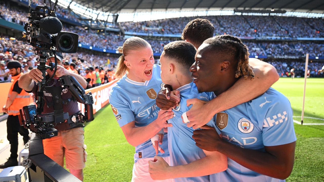 Phil Foden celebrates with Man City teammates Erling Haaland and Jeremy Doku after scoring the team&#039;s first goal against West Ham United on Sunday