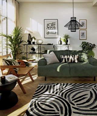 A modern living room with abstract line wall art and brushstroke rug with green sofa decor