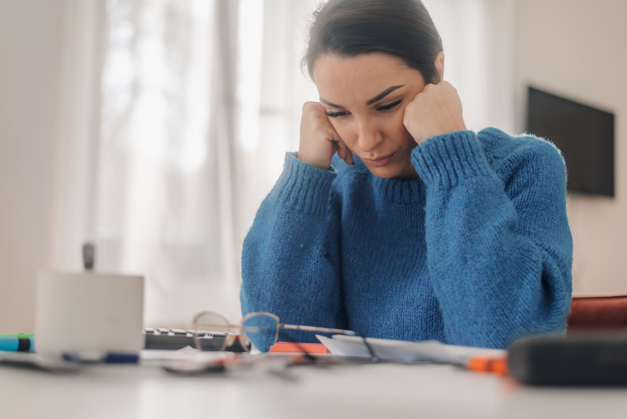 Young woman looking concerned about personal finances