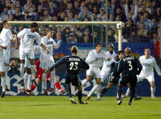 David Beckham scores a free-kick for Real Madrid against Marseille in the Champions League in November 2003.