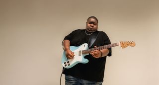 Blues phenom Christone "Kingfish" Ingram with his new signature Fender Telecaster Deluxe in Daphne Blue