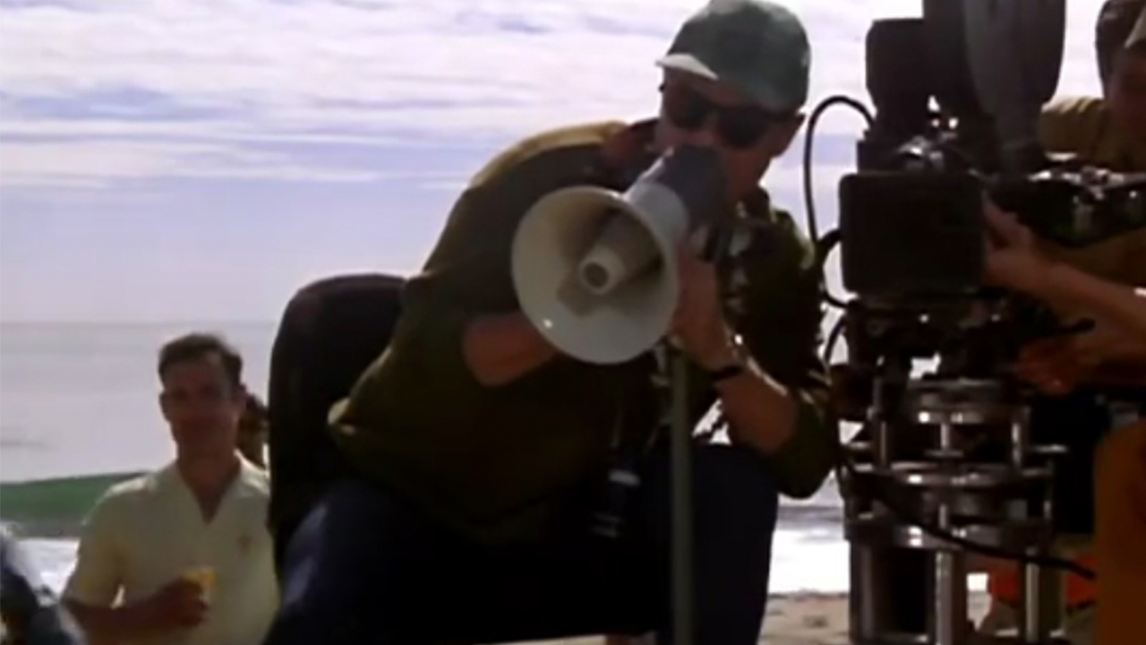 Jonathan Demme with a bullhorn in That Thing You Do!