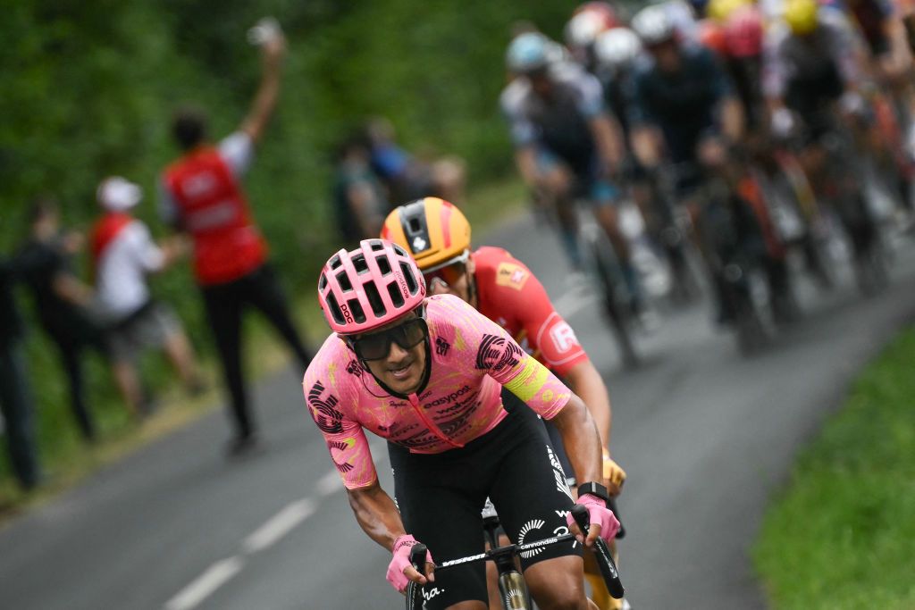EF Education - EasyPost team's Ecuadorian rider Richard Carapaz cycles ahead of Uno-X Mobility team's Norwegian rider Tobias Halland Johannessen in the Blachon ascent during the 13th stage of the 111th edition of the Tour de France cycling race, 165,3 km between Agen and Pau, southwestern France, on July 12, 2024. (Photo by Marco BERTORELLO / AFP)