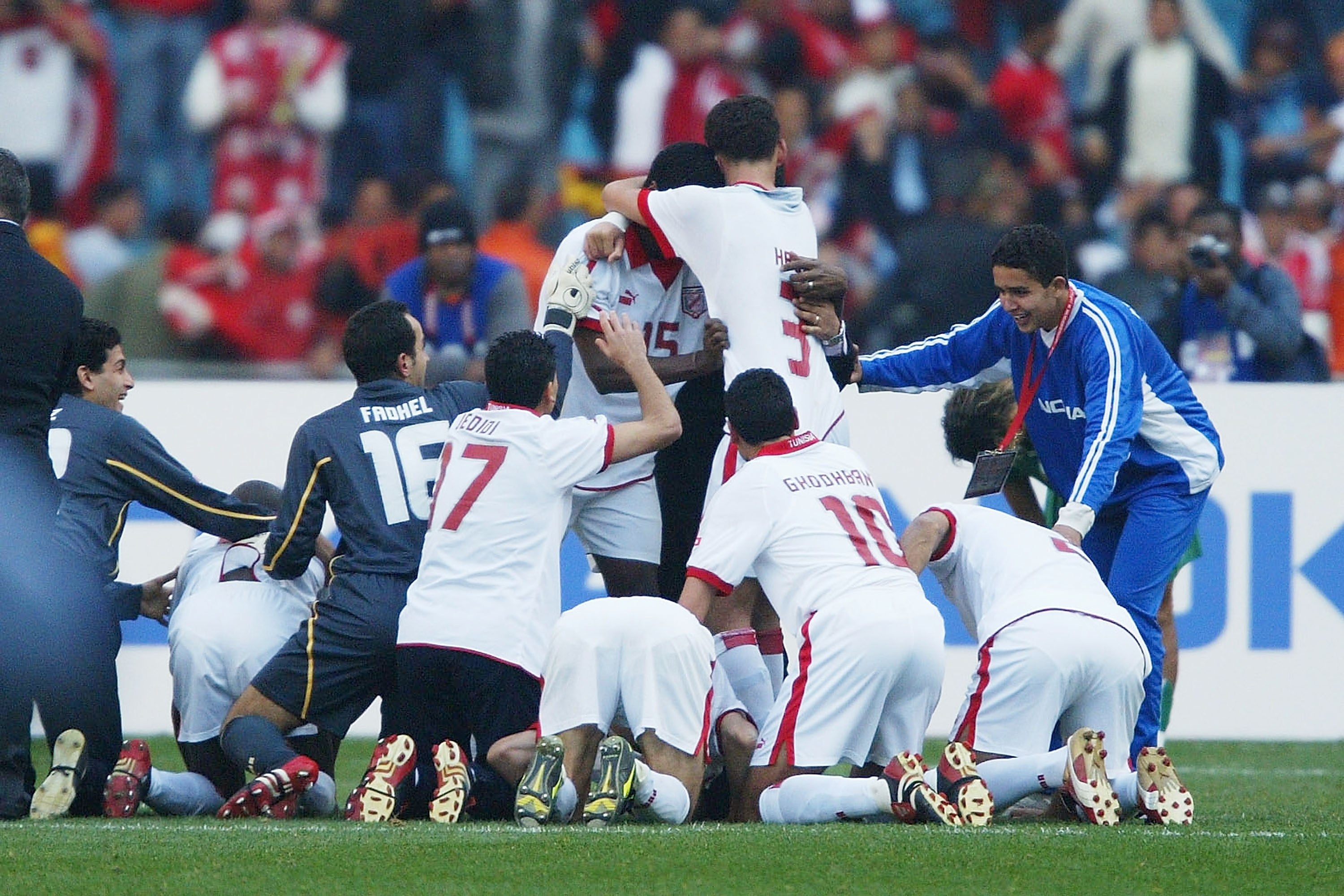 Tunisia players celebrate after beating Morocco to win the 2004 Africa Cup of Nations.