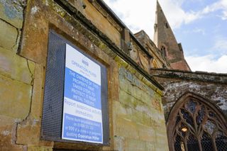 Sign on a church warning metal thieves that steps have been taken to prevent theft.