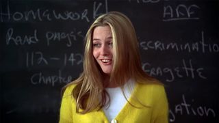 Alicia Silverstone as Cher in Clueless, talking to her class from the front of the room