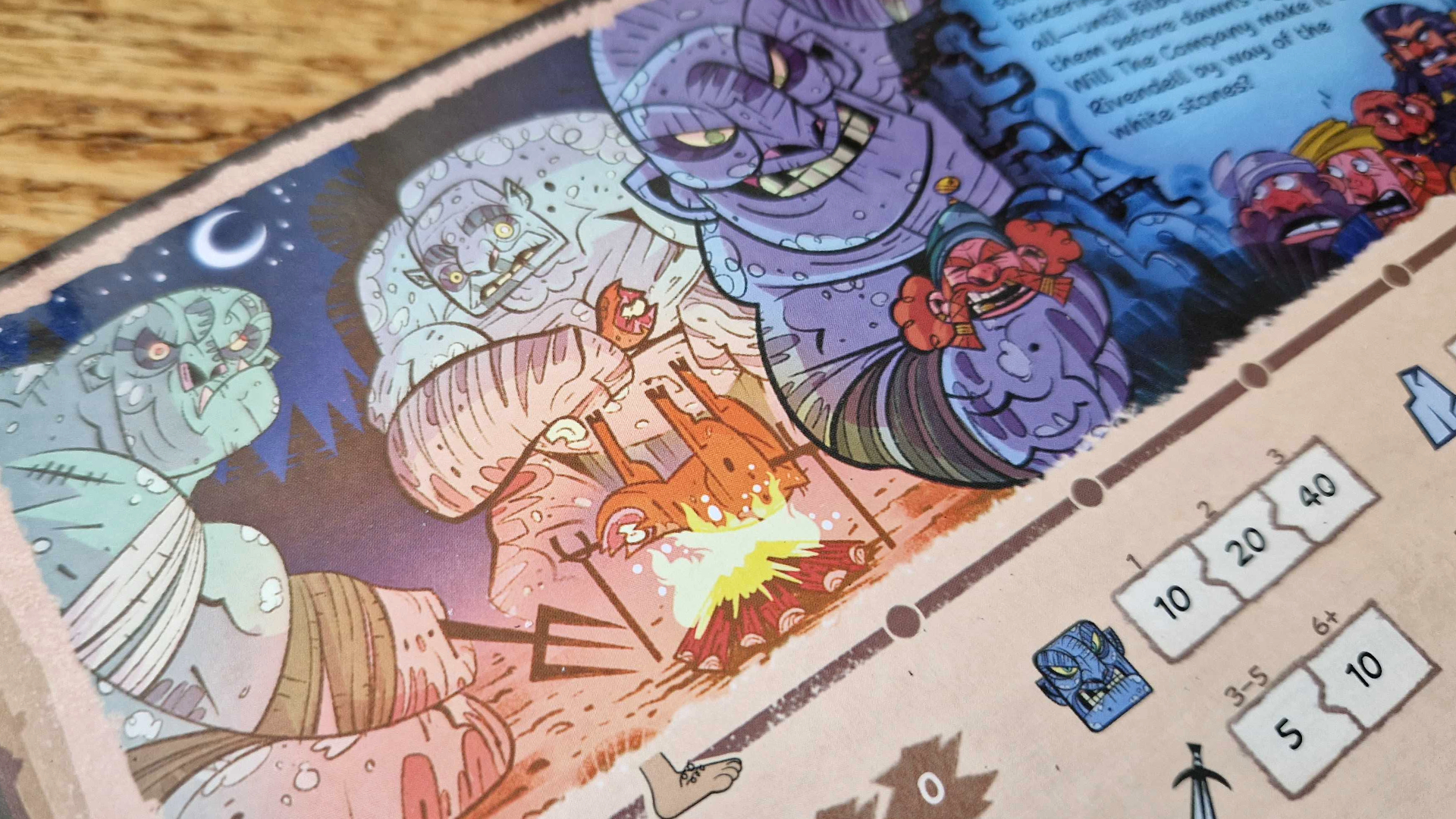 The Hobbit: There &amp;amp; Back Again components laid out on a wooden surface