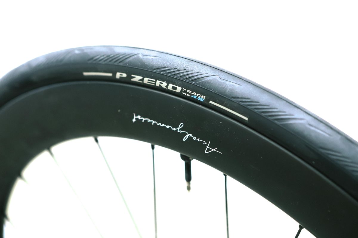 A close up of a black road bike tyre
