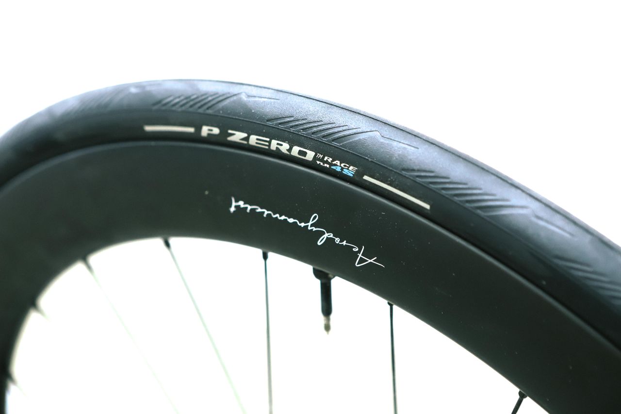 A close up of a black road bike tyre
