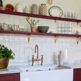 White tiled kitchen with cherry mocha painted shelving