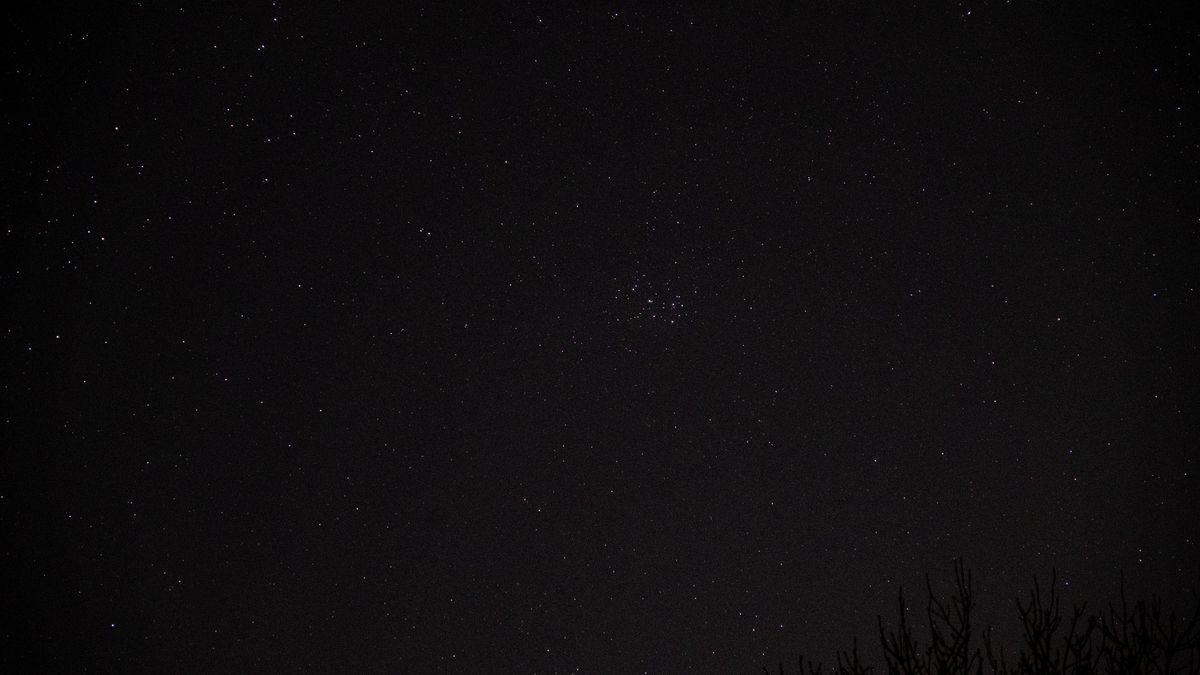 Pleaides star cluster in the night sky.