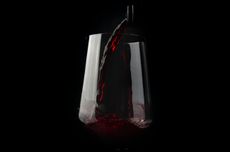 Red wine being poured into a glass
