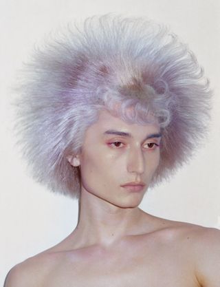 a man with purple wig