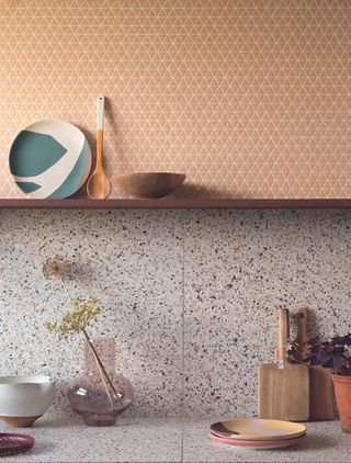 kitchen tile ideas with terrazzo backsplash and small triangle tiles