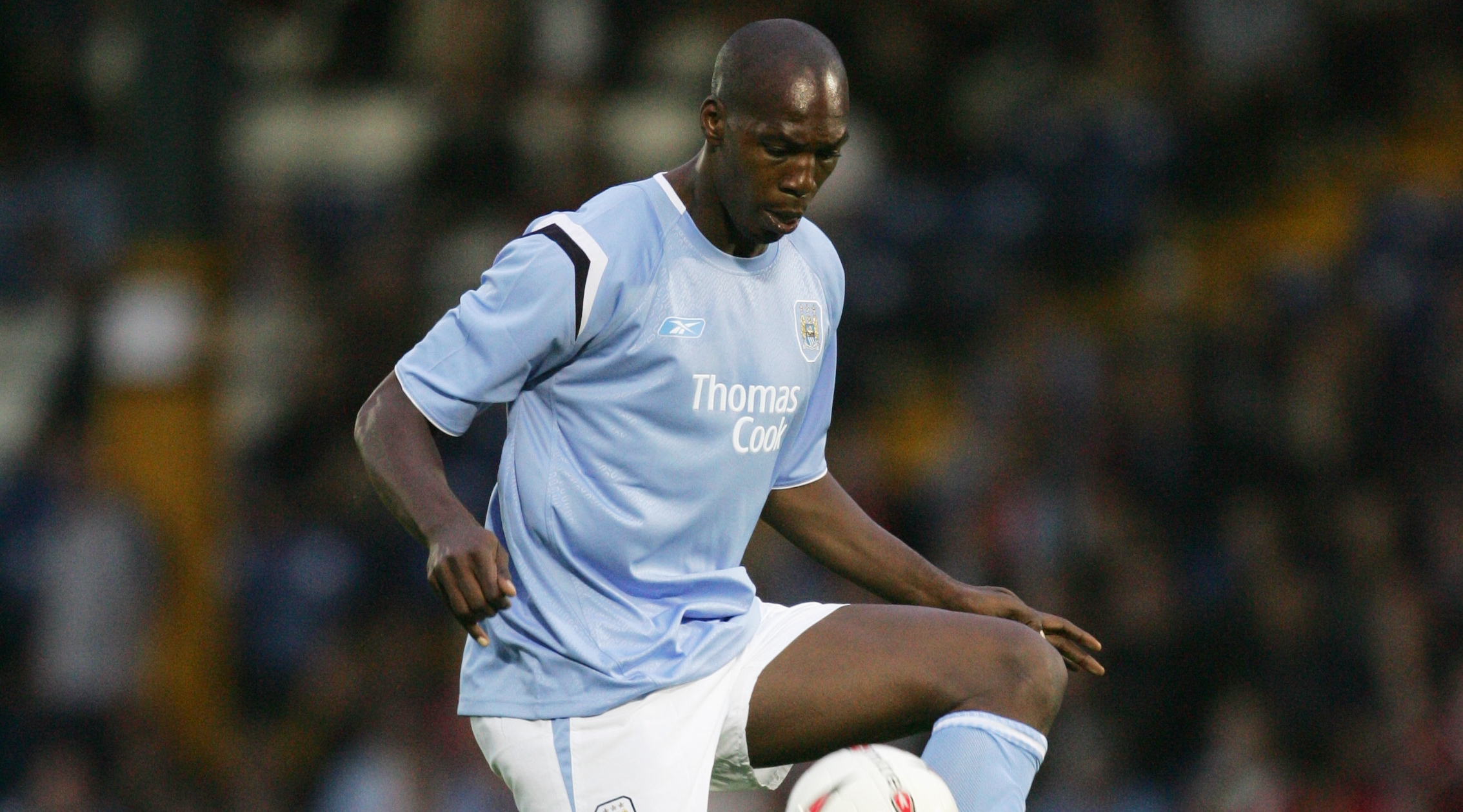 BURY, ENGLAND - JULY 21: Christian Negouai of Manchester City in action during the pre-season friendly match between Bury and Manchester City at Gigg Lane on July 21, 2004 in Bury, England. (Photo by Alex Livesey/Getty Images)