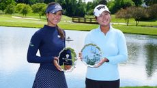 Yana Wilson and Gina Kim with the Dow Championship trophies