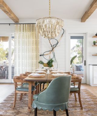 coastal farmhouse style dining room with rustic elements and natural rug