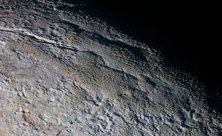 Snakeskin ridges on Pluto may have been shaped by surface winds, one way Pluto's atmosphere could have contributed to the dwarf planet's unusual features.