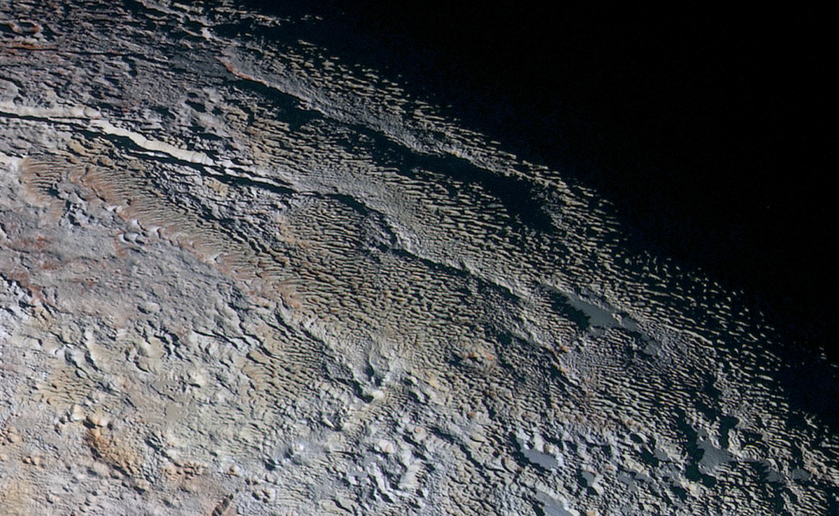Snakeskin ridges on Pluto may have been shaped by surface winds, one way Pluto's atmosphere could have contributed to the dwarf planet's unusual features.