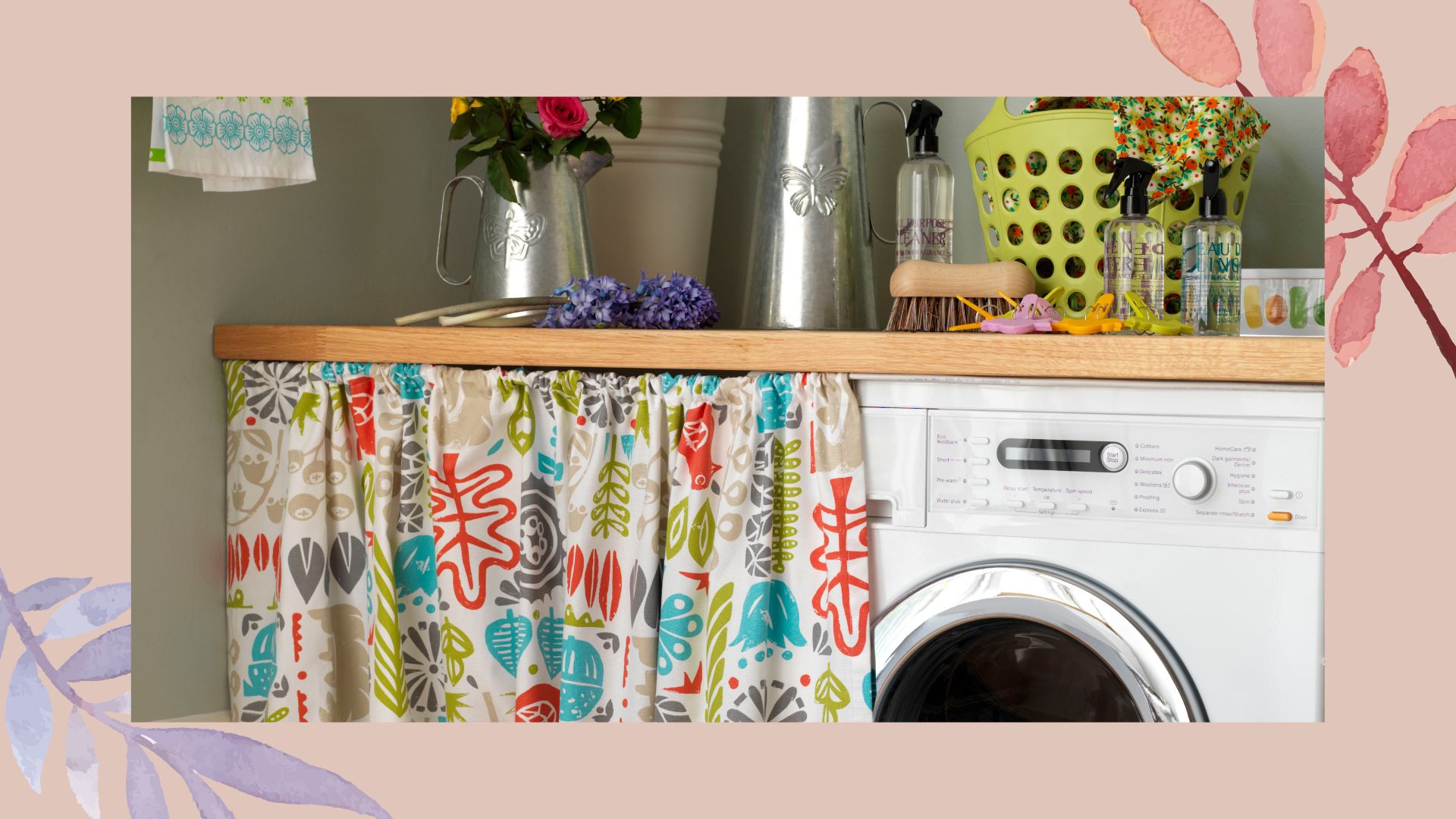 Close up shot of a washing machine with a patterned cabinet curtain pulled across 