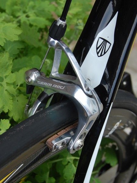 A SRAM Red brake caliper is fitted with carbon-specific pads.