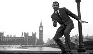 On Her Majesty's Secret Service George Lazenby takes aim outside of Parliament