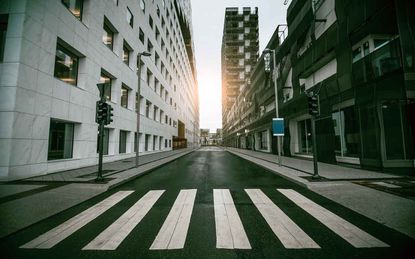Empty Urban Street with Skyscraper at Sunrise