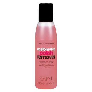 A bottle of pink nail polish remover by the brand OPI.