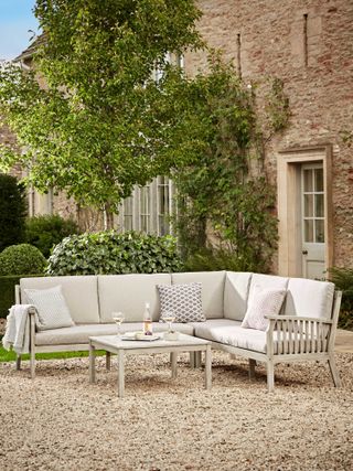 outdoor seating ideas: white corner sofa cox & cox