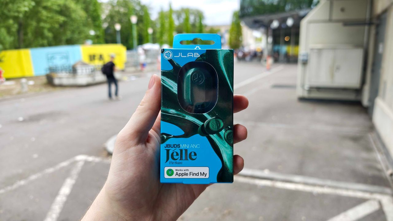 JLab's new earbuds at IFA, on a blue table