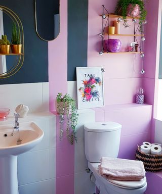 bathroom makeover using color blocking technique in pink and dark blue