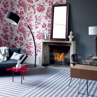 room with striped floor and red and white wallpaper