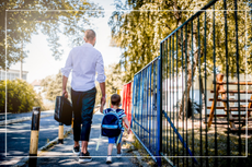 Father walking son to school