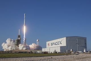 A SpaceX Falcon 9 rocket launches the SES-10 satellite into orbit from Cape Canaveral Air Force Station, Florida on March 30, 2017. SpaceX reused a Falcon 9 first stage, a space first, during the launch.