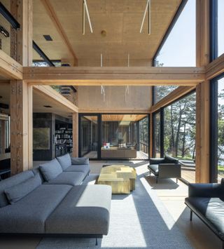 Looking east across the double-height living room, with the library mezzanine to the left