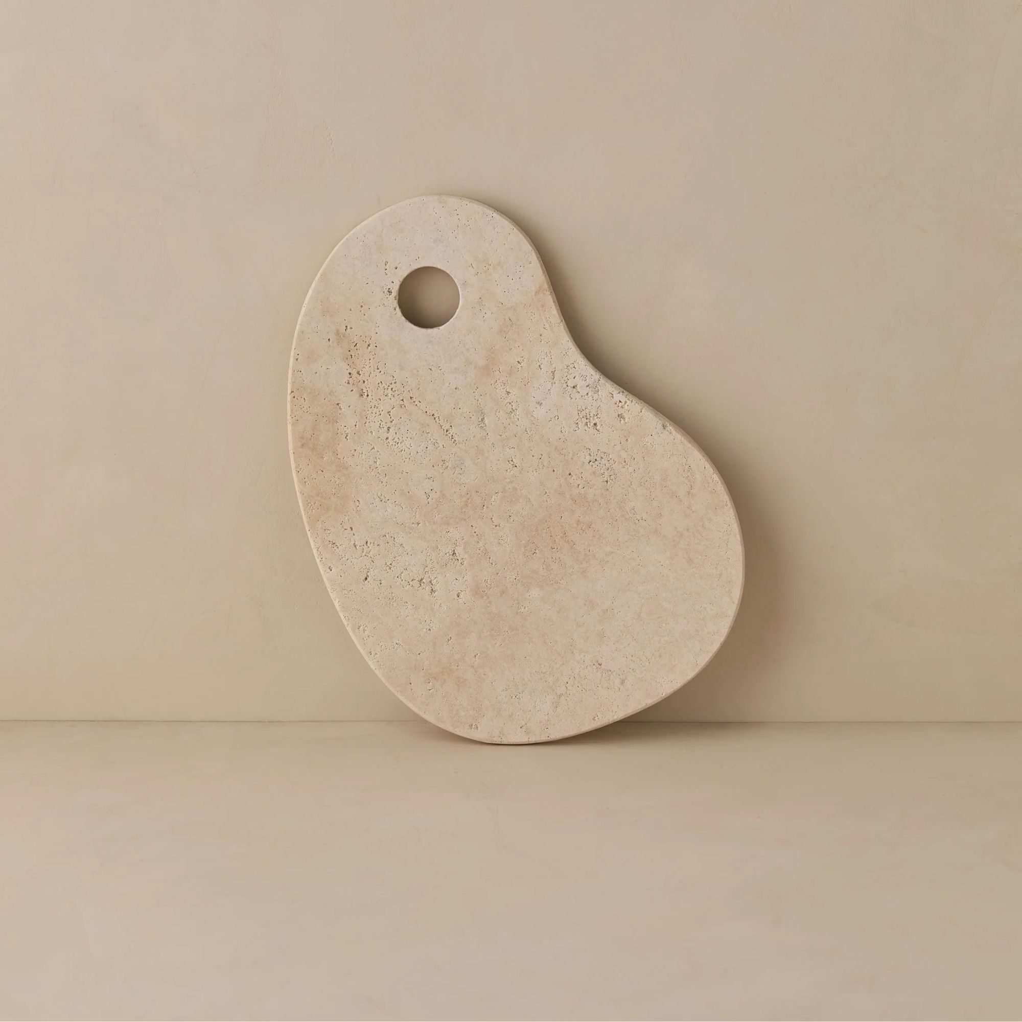 Kidney-shaped cream marble cheese board