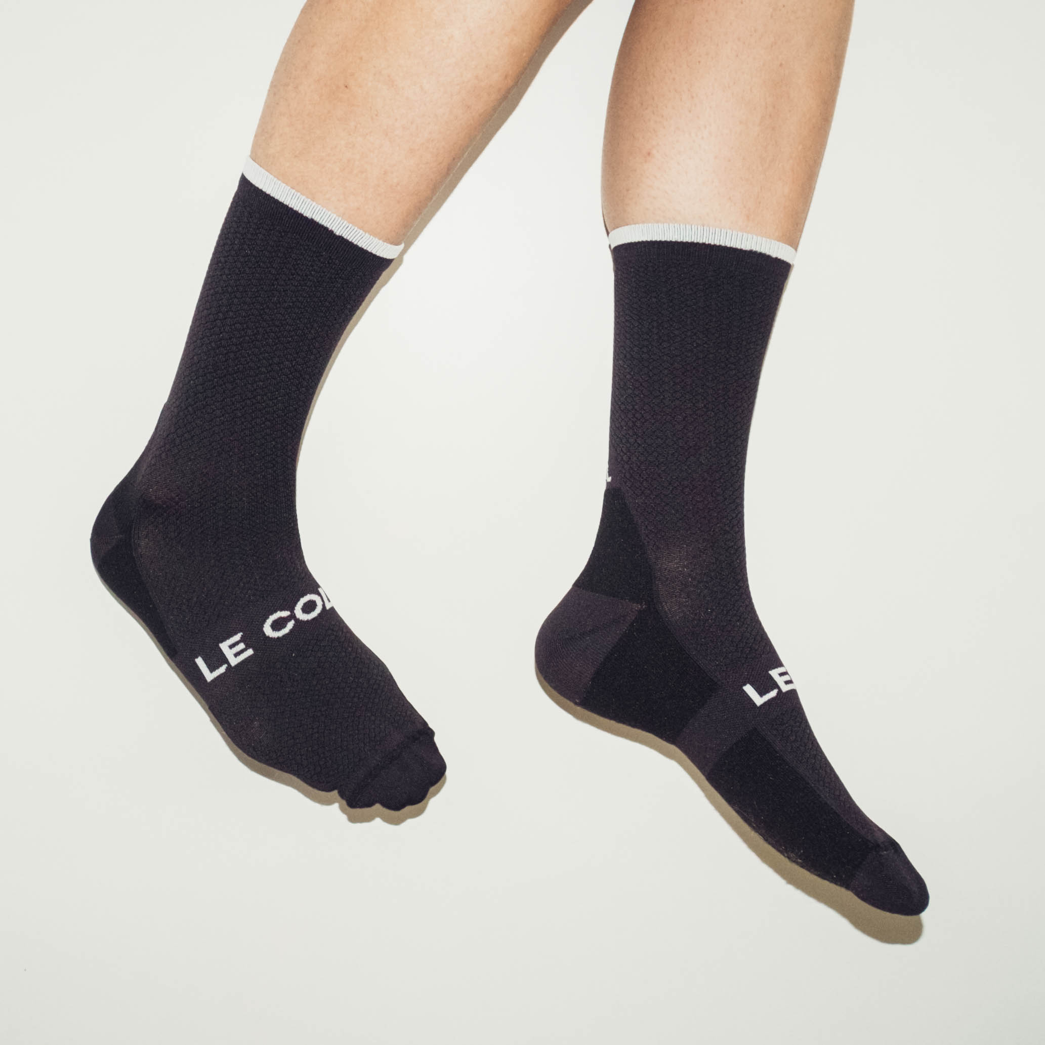 Le Col Cycling Socks being worm against a white background