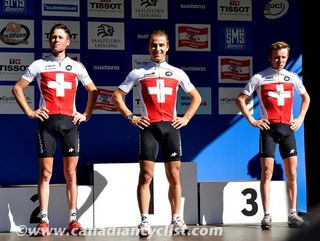 The elite men's podium: Lukas Flueckiger, Nino Schurter and Mathias Flueckiger