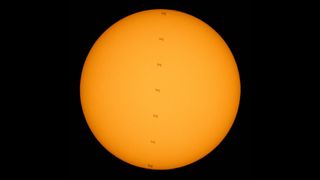 The International Space Station crossing the sun's disk.