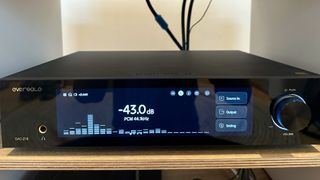 The Eversolo DAC-Z10 on a hi-fi rack, showing a frequency range readout on the screen