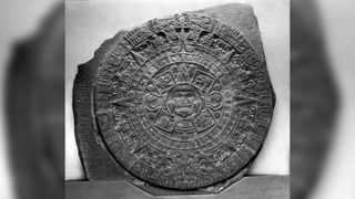 Here, a stone slab etched with the Maya calendar.