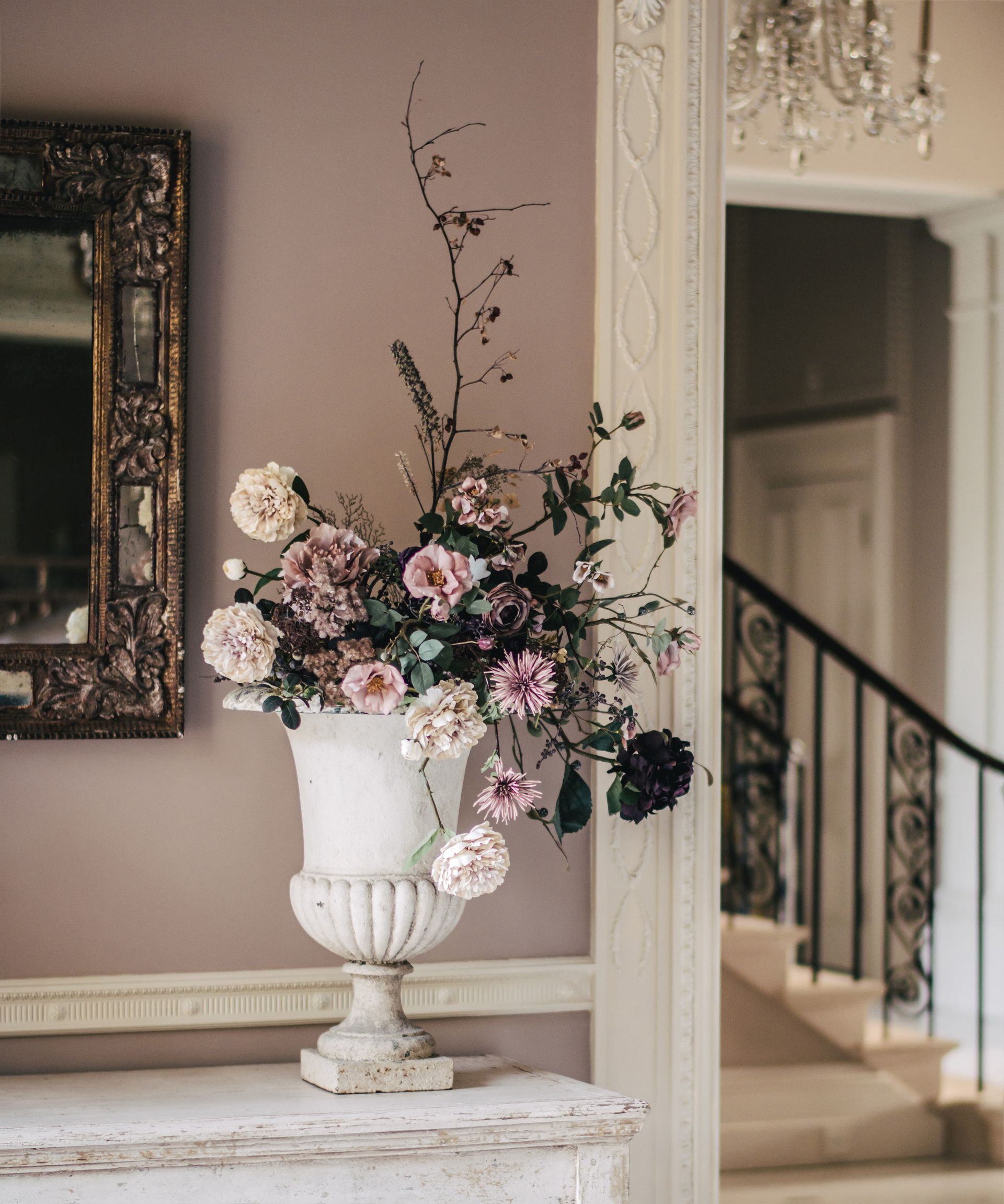 Silk roses and dried stems in a large floral arrangement
