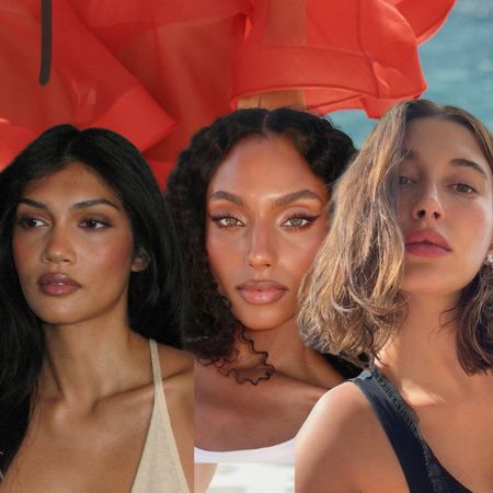 three women with glowing, tan makeup on a blue and red background