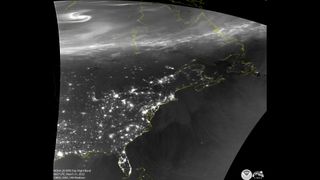NOAA's polar-orbiting NOAA-2 weather satellite snapped a black and white picture of auroras above the North Pole after a powerful geomagnetic storm hit Earth on March 30, 2022.