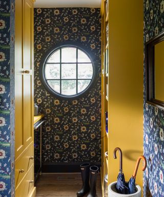 Yellow boot room with blue wallpaper