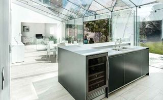 Contemporary kitchen-diner in glazed extension to a period home
