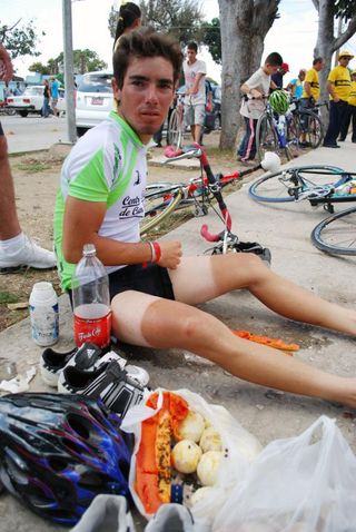 A rider begins to refuel post-stage