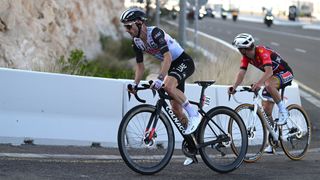 Adam Yates and Remco Evenepoel on the road in the 2023 UAE Tour.