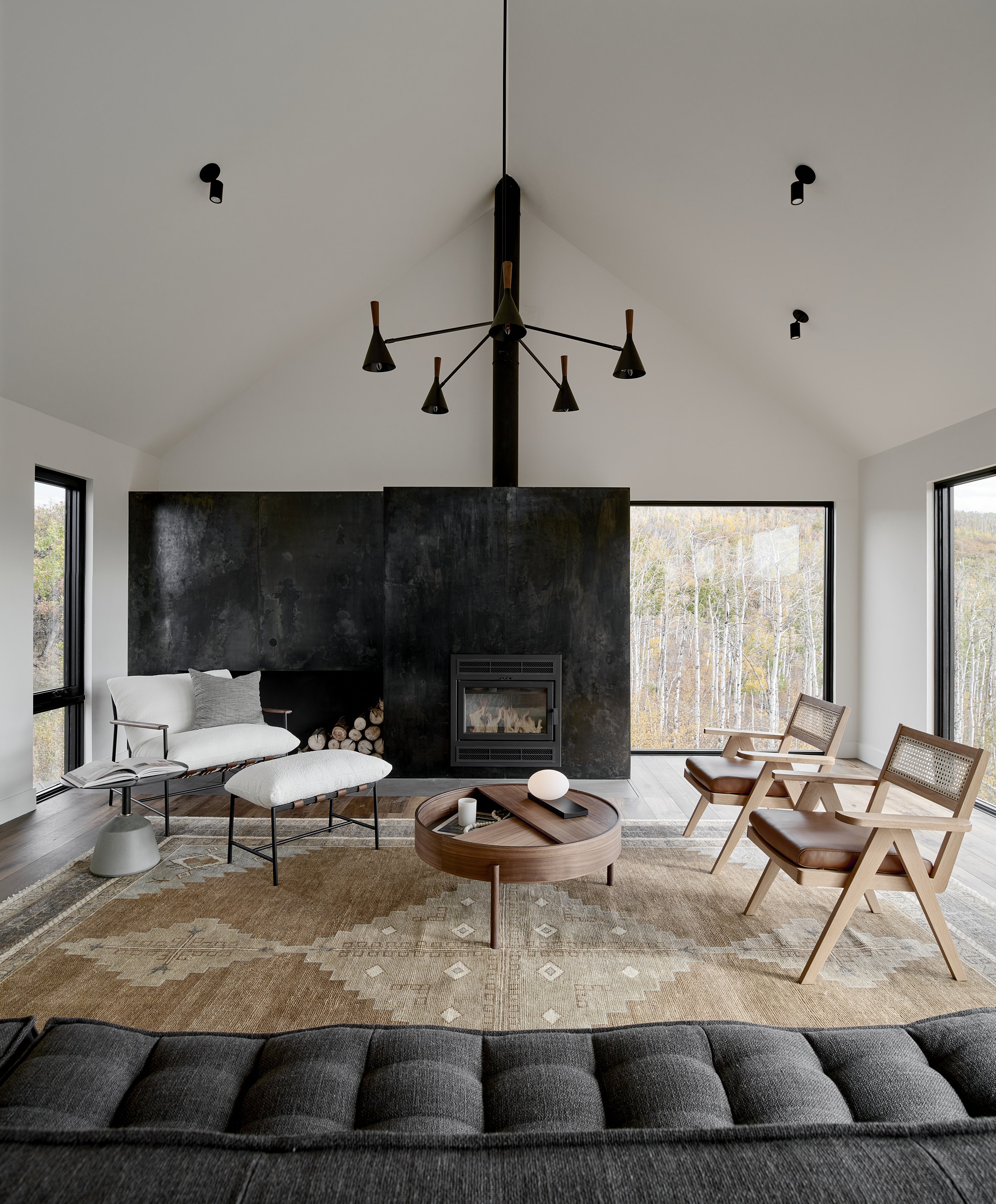 A fireplace surround with an open shelf for firewood