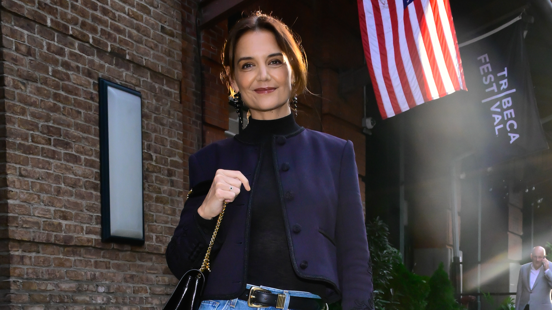 Katie Holmes attended a NYFW event in wide-leg jeans and a cropped jacket